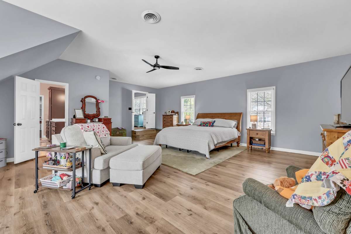 Bedroom 5 with closet and entry into renovated bath