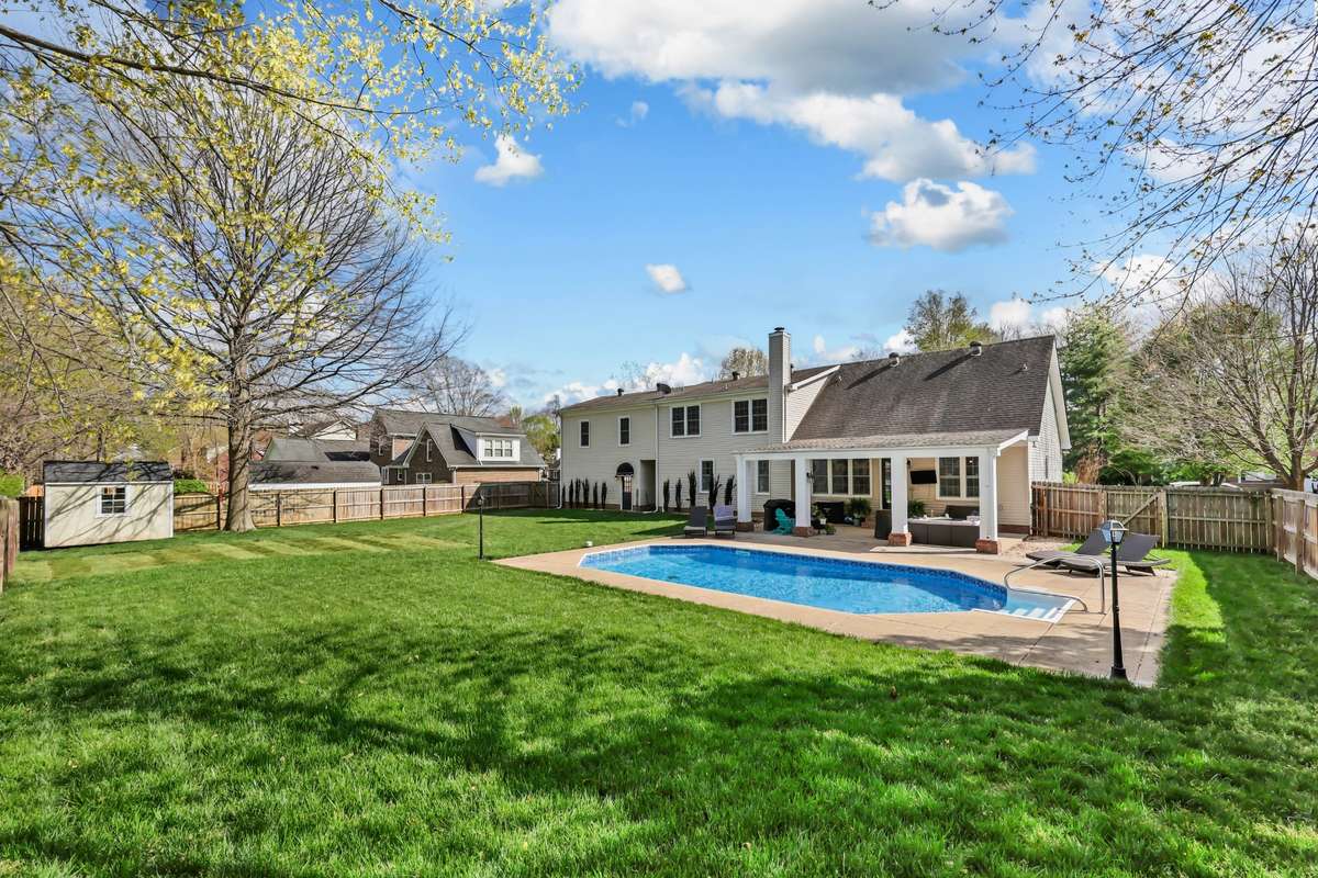Meticulously maintained yard and sparkling pool! Fresh sod was recently laid in an area where a playground has been removed.