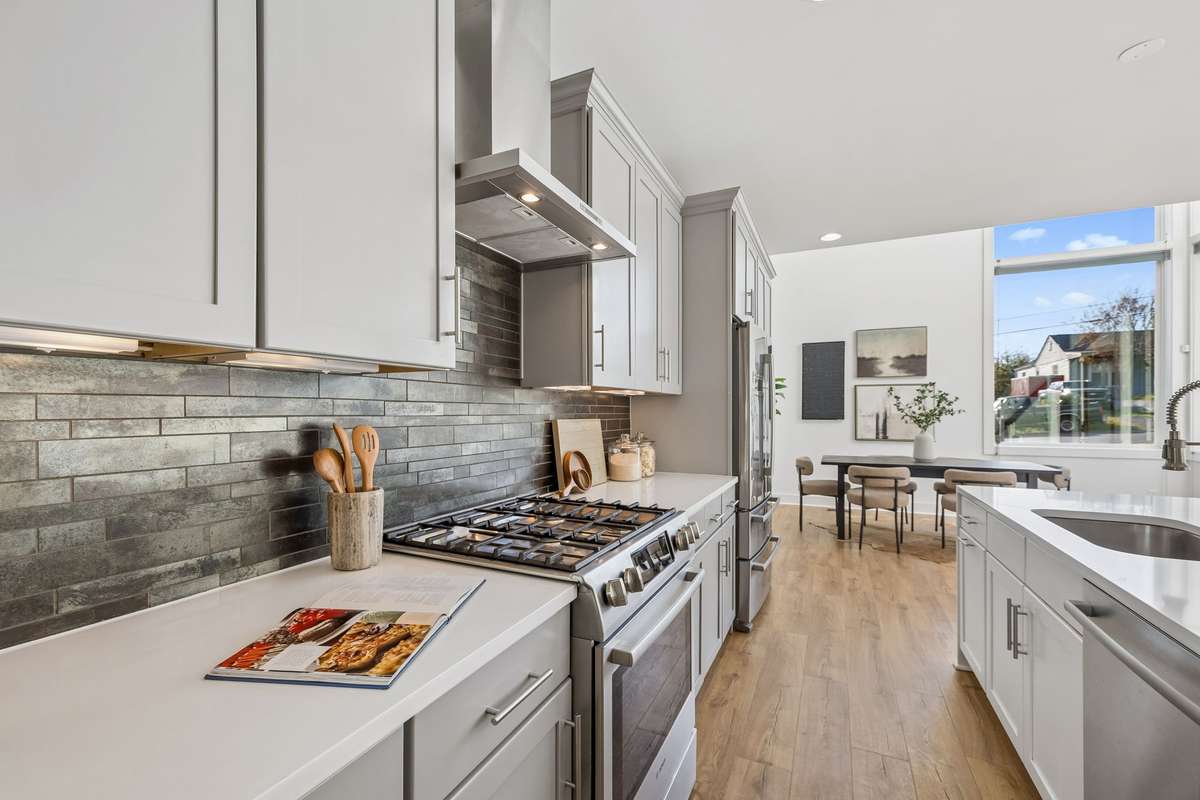 The stainless steel appliances include a high-end gas range.