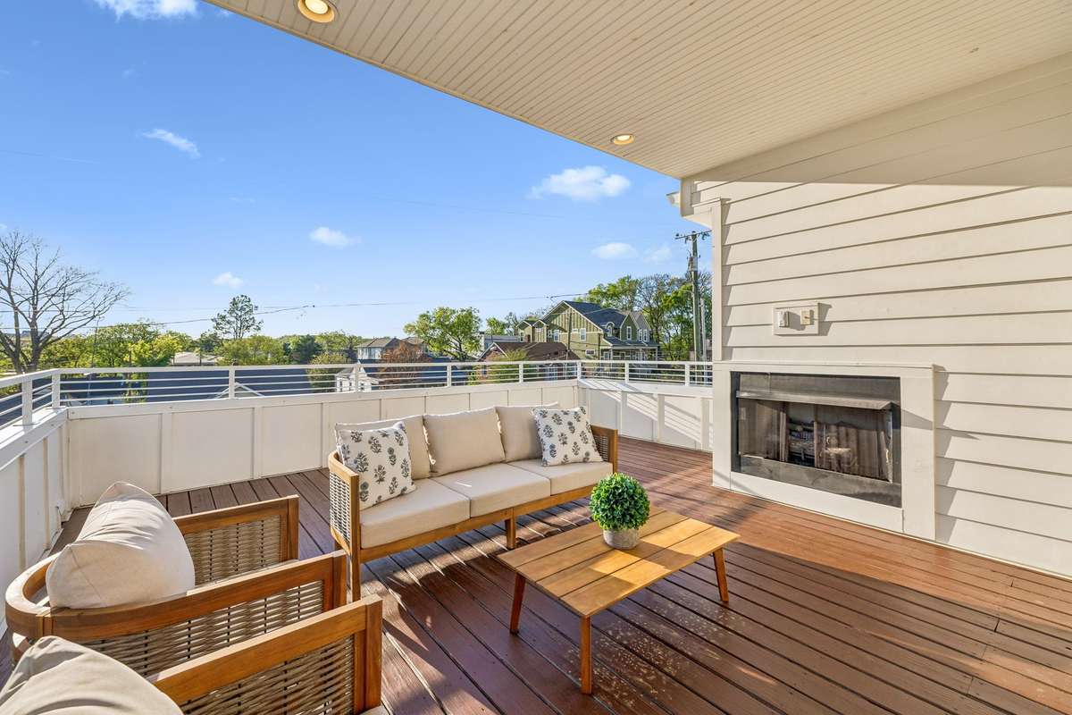 It features multiple rooftop decks and a gas fireplace for year-round enjoyment!