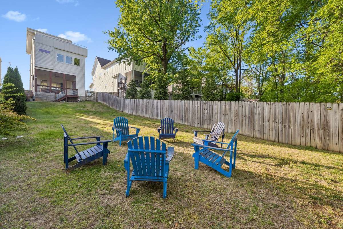 The deep backyard is fully fenced so that pets can play safely.