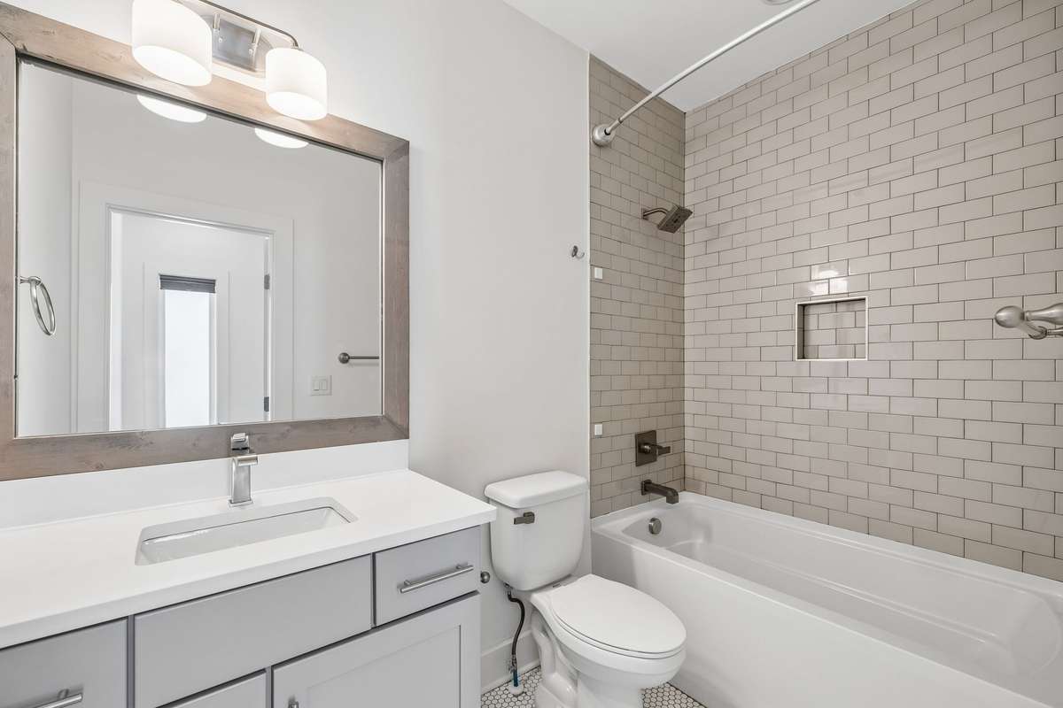 Another elegant full bath is easily accessible to both bedrooms.