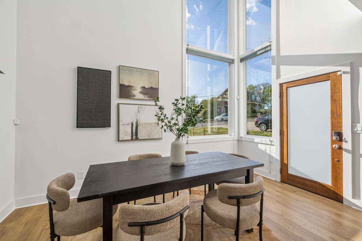 Tall windows fill the dining area with incredible natural light.