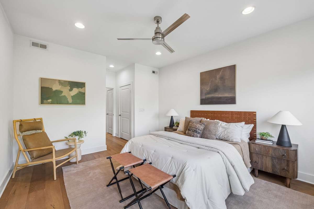 Continue upstairs to the beautiful owner's suite! It includes multiple walk-in closets with built-in shelving.