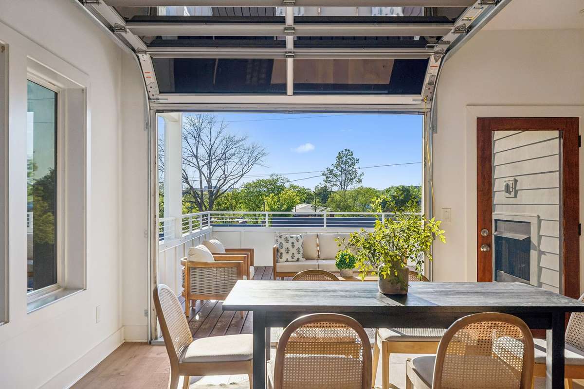 The garage door can be easily opened to create an indoor-outdoor entertaining space.