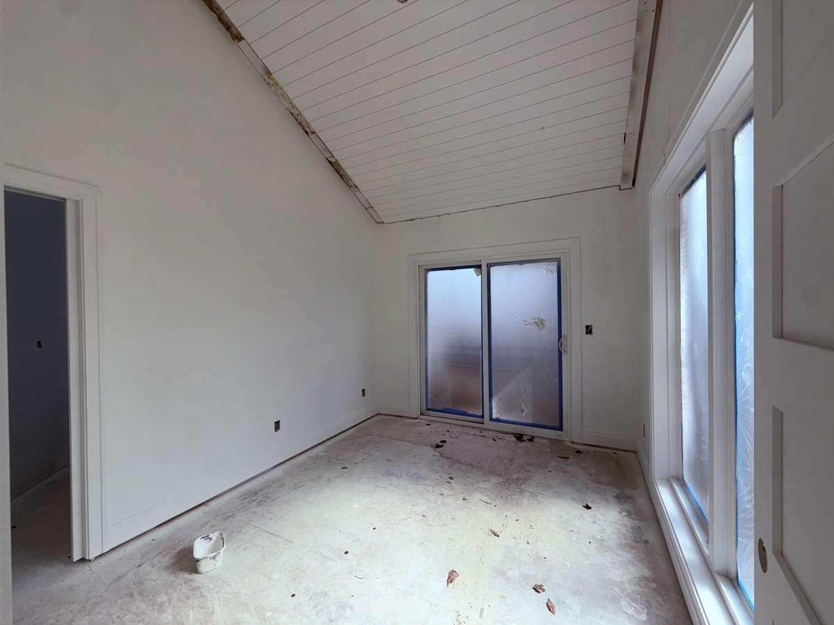 Second bedroom has a full bath and lots of sunny windows.