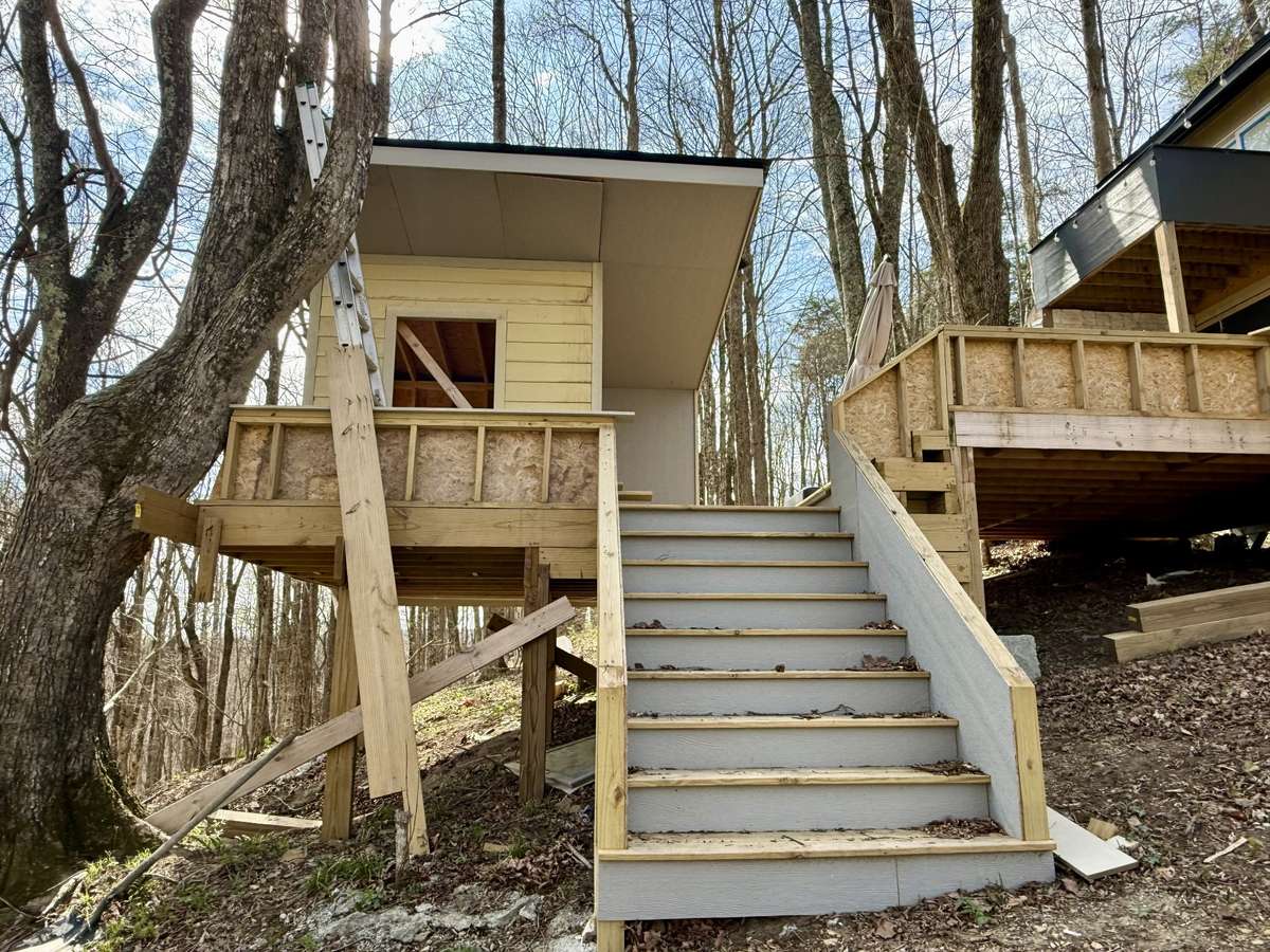Elevate your outdoor living experience with this unfinished outdoor sauna, seamlessly attached to your tiny home.