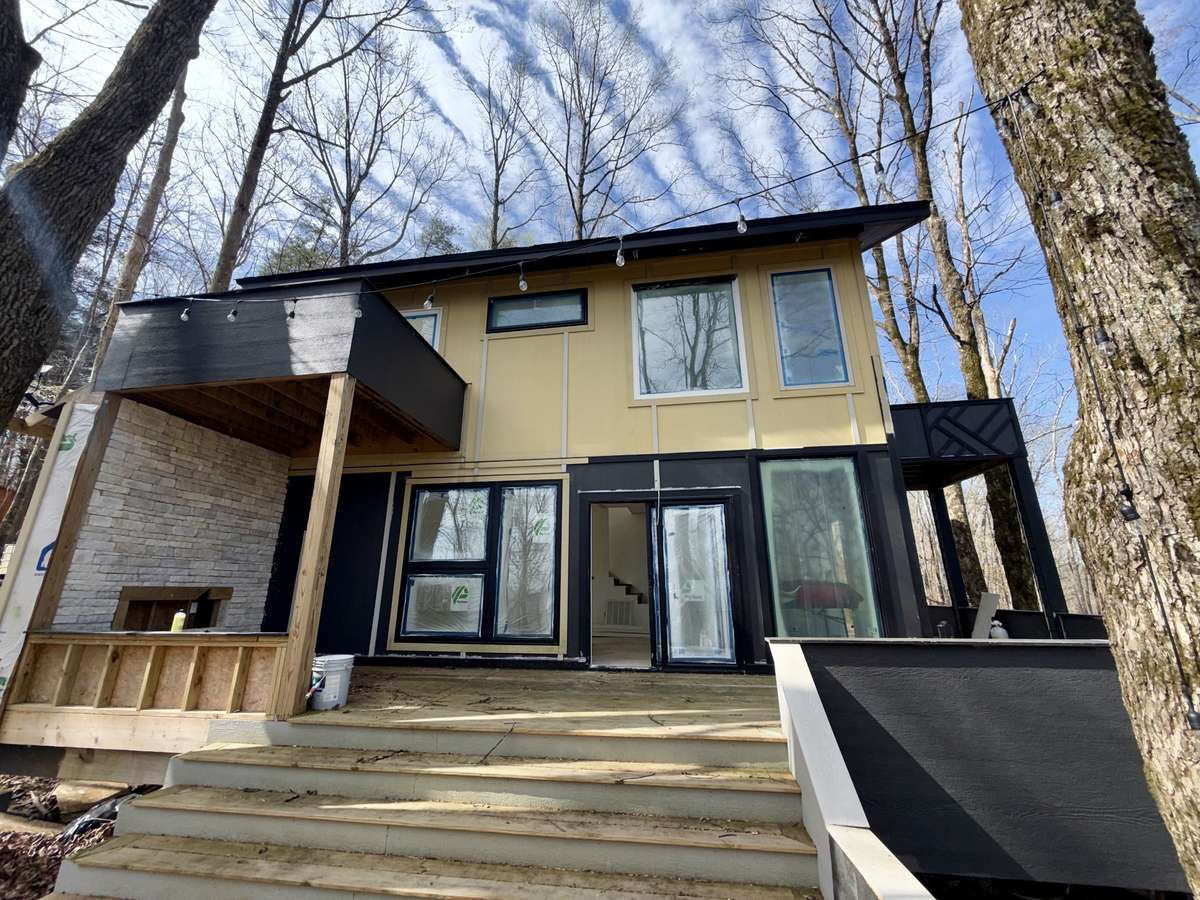 This expansive deck is the ideal space for entertaining, relaxing, and enjoying the beautiful surroundings. Conveniently located just off the living area, the sliding doors seamlessly connect the indoors with the outdoors.