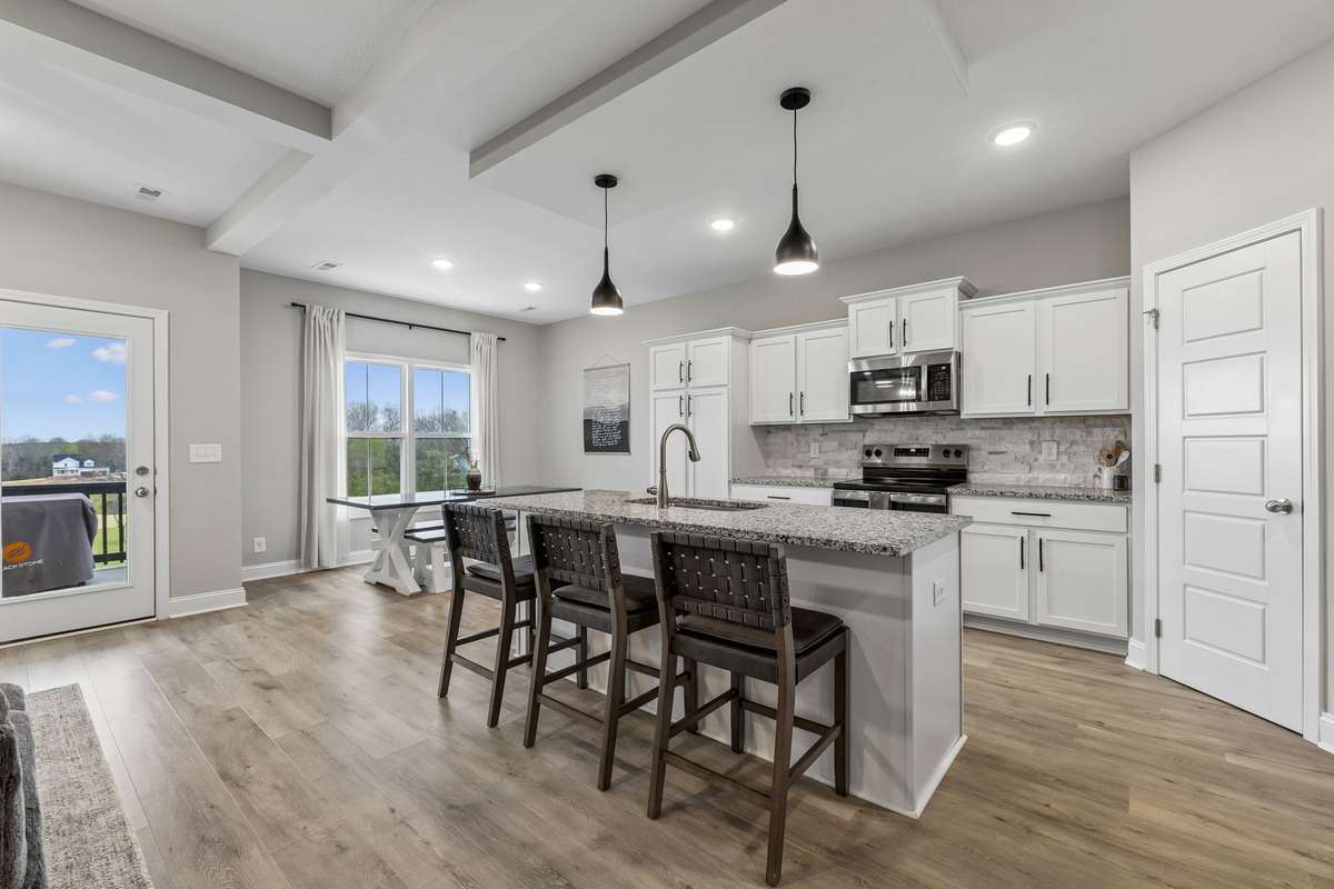WOW! Awesome cabinet space and a LARGE pantry closet in corner of kitchen. Coffee bar, large island, and stainless steel appliances! || GREAT EXIT TO COVERED BACK PATIO!! A portion of it is uncovered perfect for grilling!!!