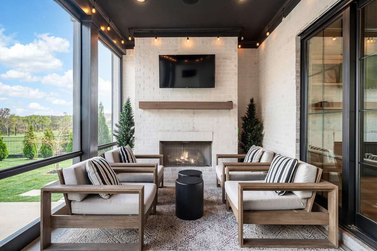 Sitting area w/Fireplace in Screened-In Patio