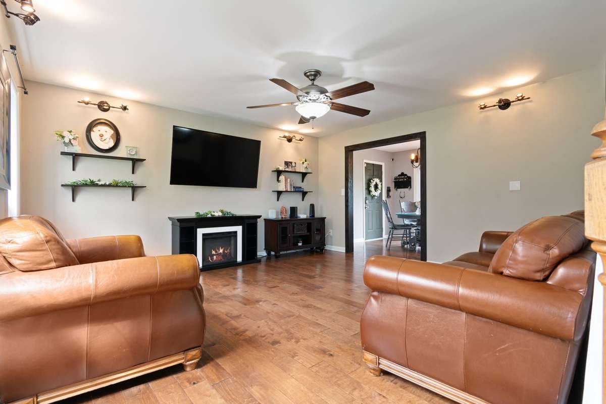 The cozy living room is made for relaxing, featuring warm finishes perfect for entertaining guests.