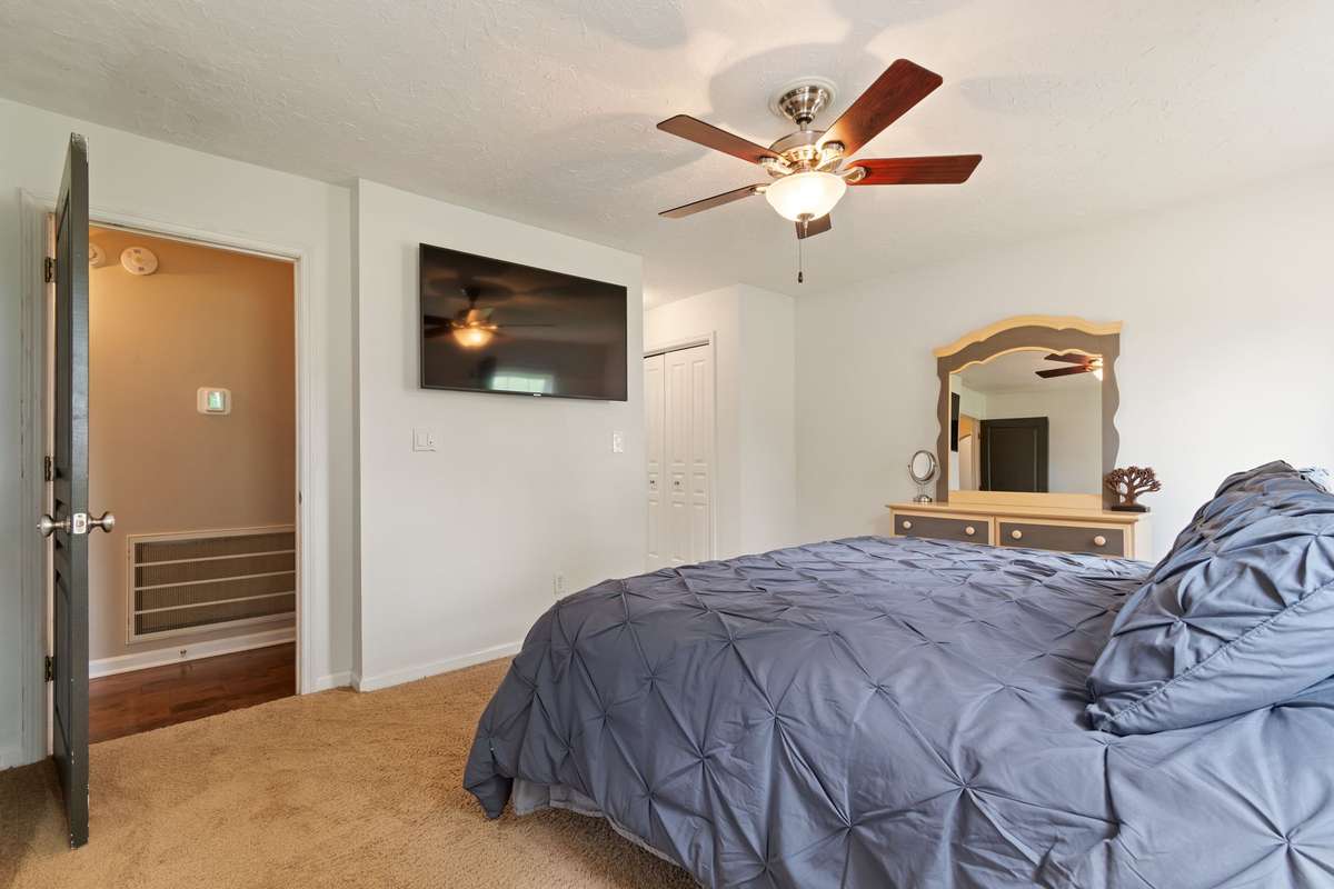 The primary bedroom feels bright and relaxing, featuring a cozy layout that’s easy to make your own.