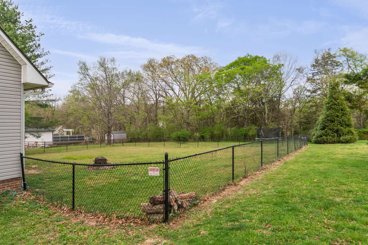 The yard provides a great space for pets, playtime, and outdoor fun, with room to spread out.