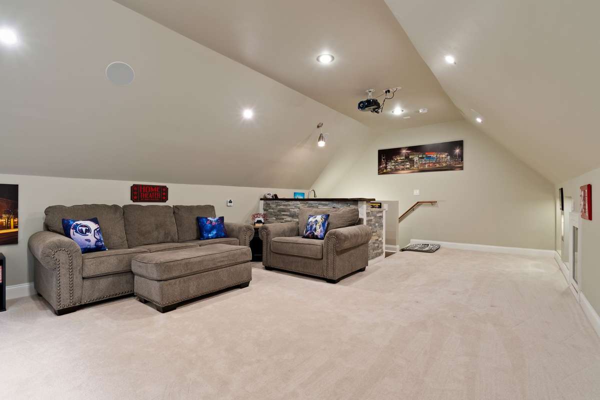 This versatile bonus room combines comfortable seating with an open layout that’s great for gatherings.