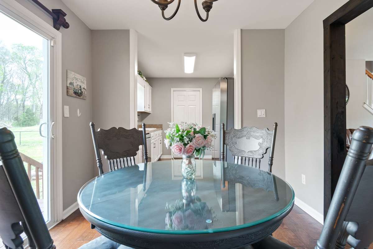This inviting breakfast nook is the perfect spot for morning coffee or breakfast with the family, with easy flow into the kitchen.