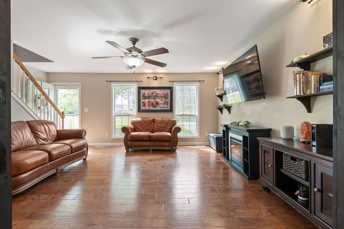 Another view of the living room shows the easy flow to the entry and beyond, offering a comfortable layout with room to spread out.