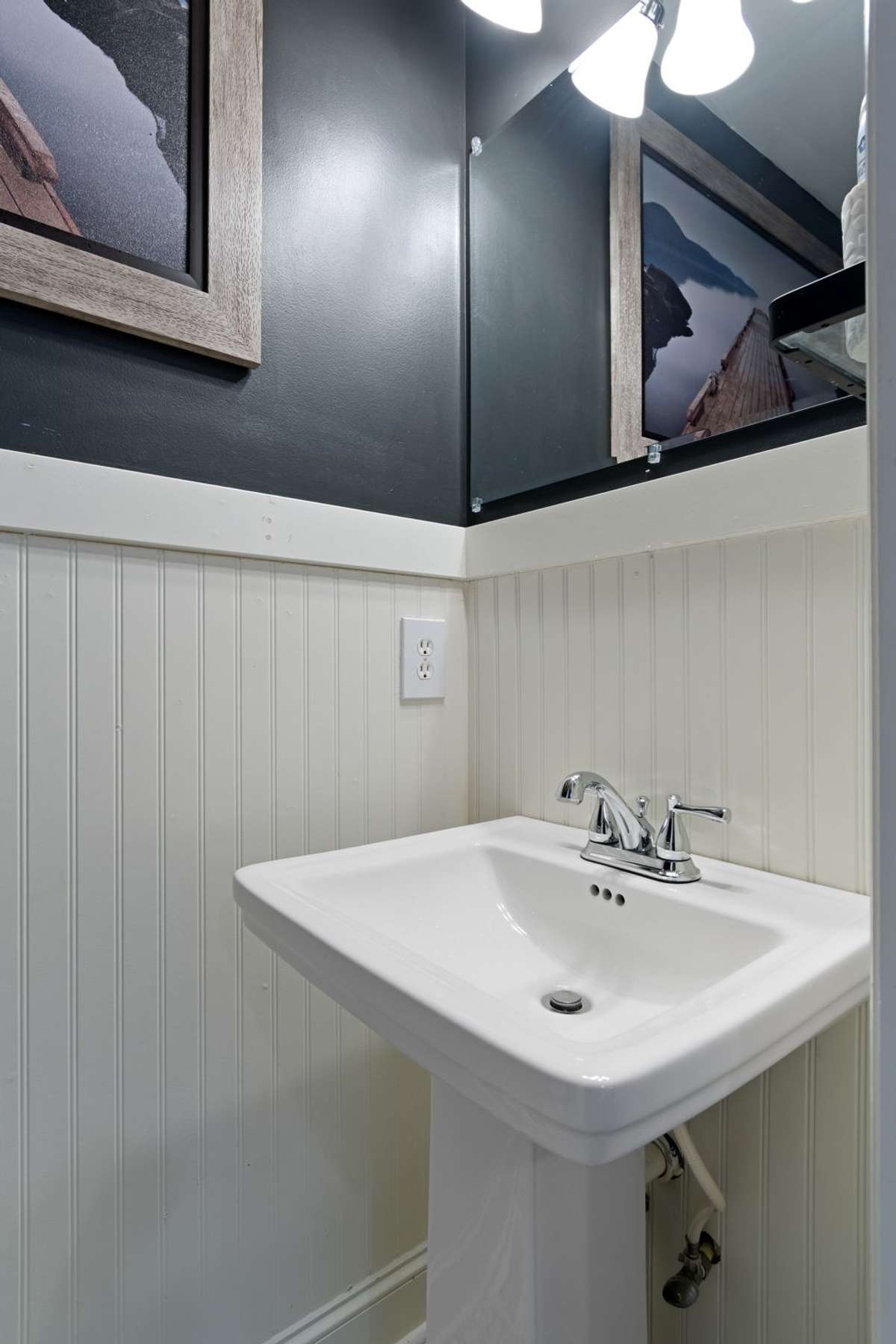 Clean lines and crisp finishes give the powder room a bright, updated feel.