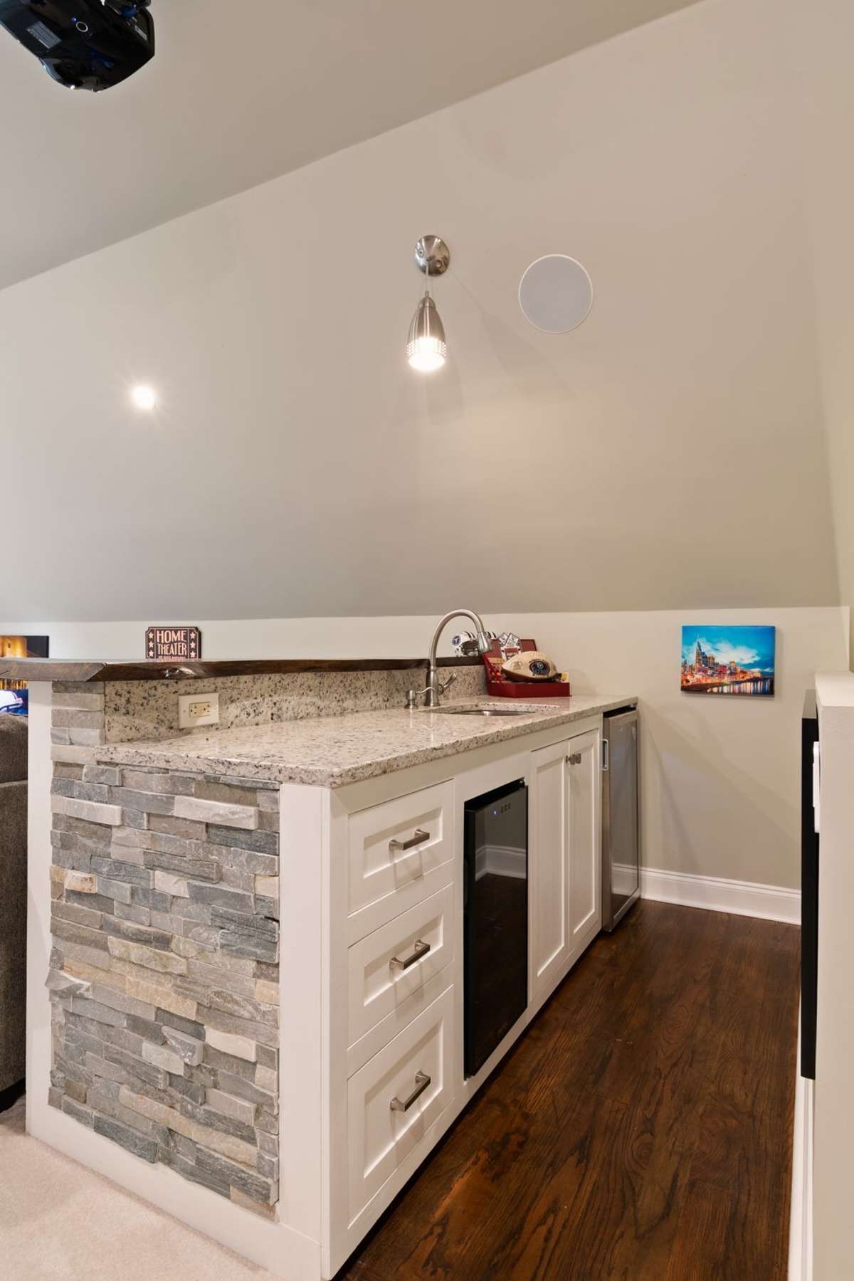 With a built in bar, fully equipped with a sink, refrigerator, and plenty of storage, this bonus room is ready for entertaining.