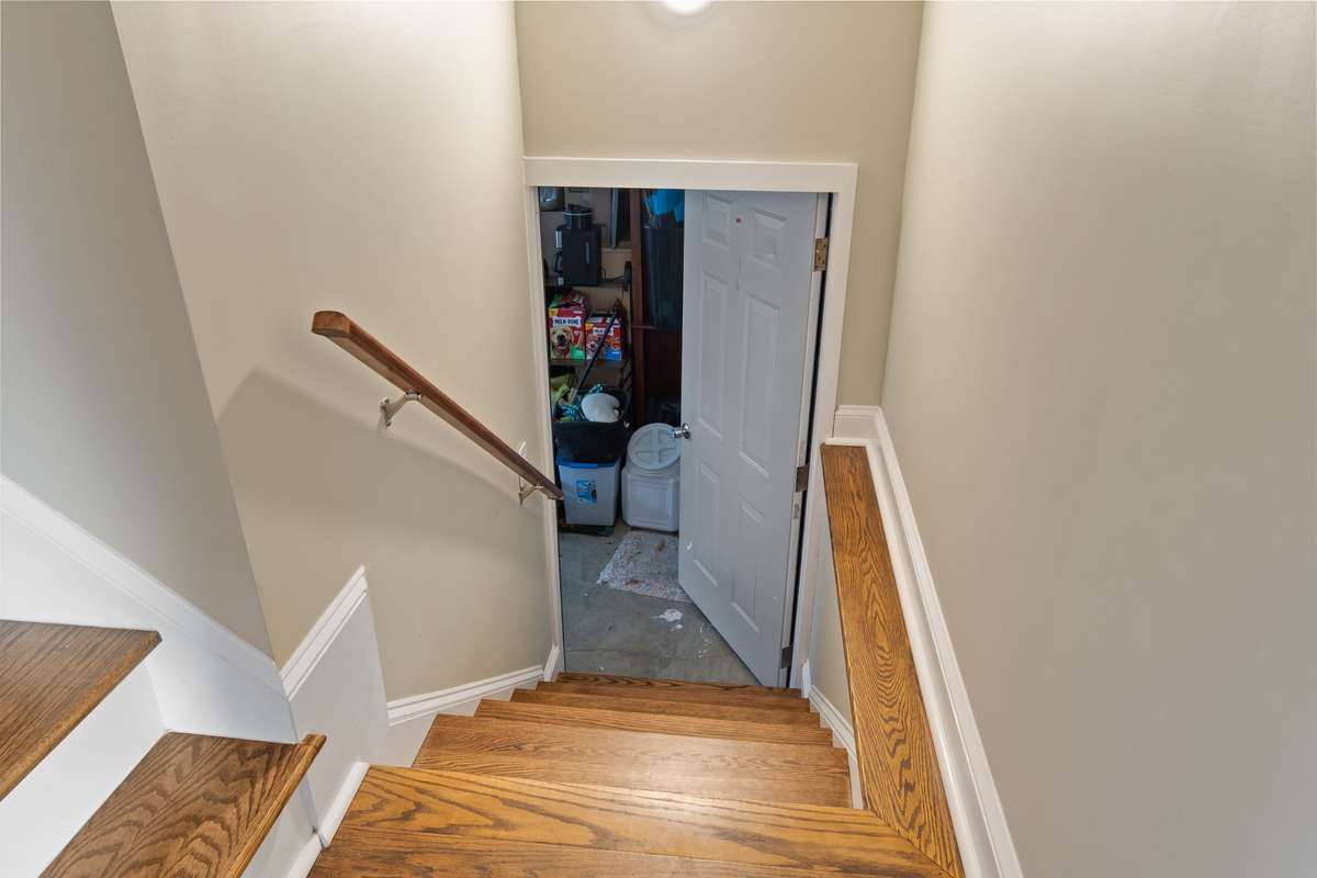 An additional staircase offers convenient access to the 2 car garage and bonus room.