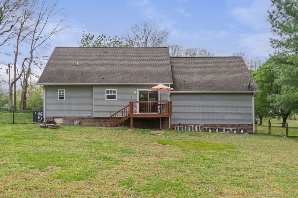 From the deck, you’ll appreciate the great sightlines across the lawn to the firepit and outdoor gathering area.