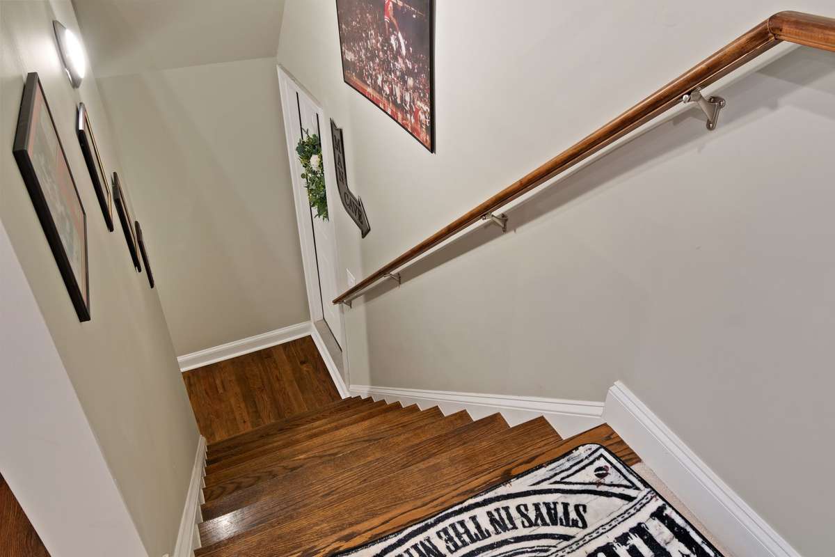 A bright, easy-to-navigate stairwell connects levels smoothly and adds to the home’s comfortable flow.
