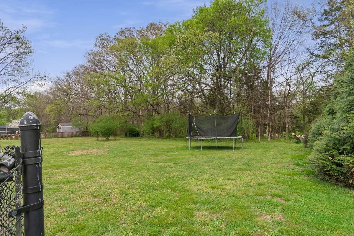 This open, grassy area is ideal for games, gatherings, and enjoying the fresh air in a private setting.