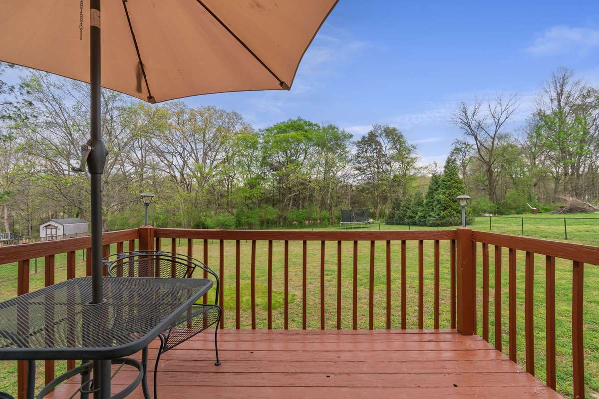 Take in the open yard and surrounding greenery from your deck, with plenty of space to enjoy the outdoors.