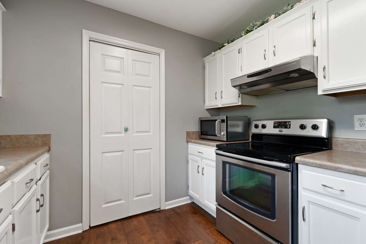 Enjoy a well-equipped cooking space with ample counters and storage, ready for weeknight meals or weekend hosting.
