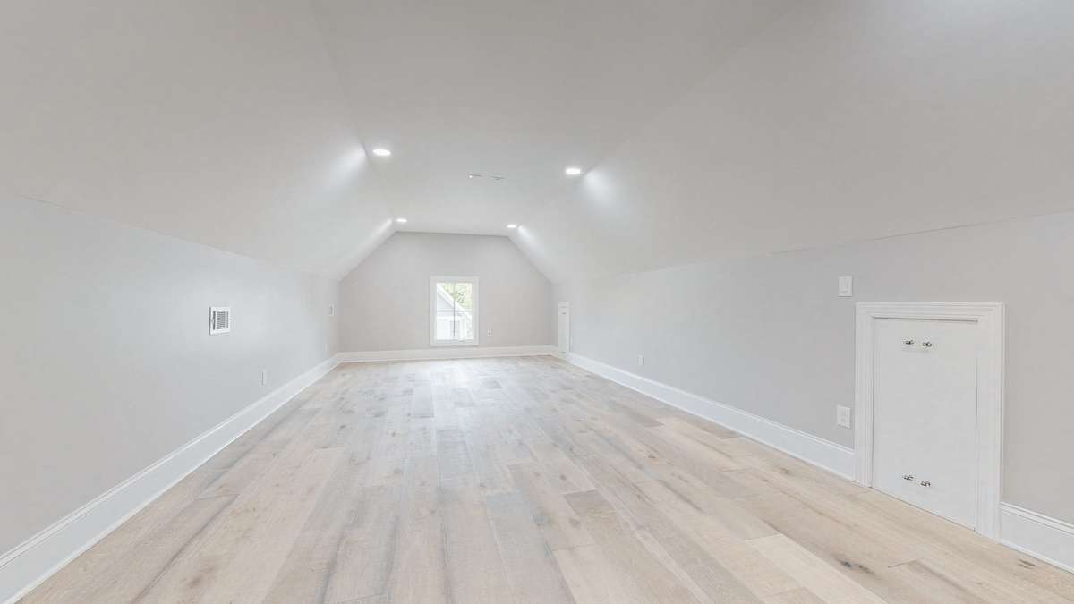Huge 3rd floor bedroom or bonus room is wired for sound and a projector