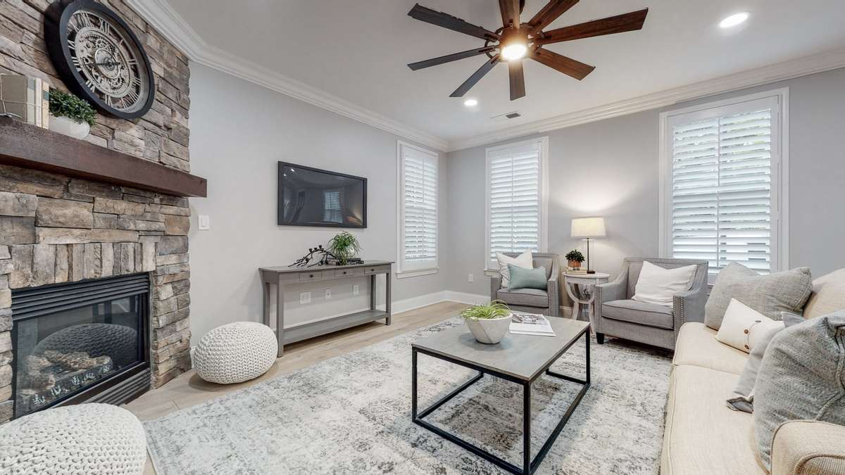 Renovated home with stacked stone gas fireplace, new hardwoods, lighting and paint!