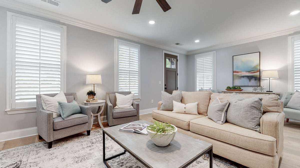 Plantation shutters on most windows and tremendous natural light in the living room