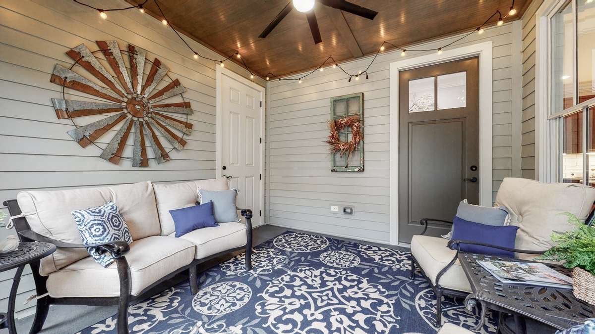 Screened porch leads from the kitchen and drop zone to the two-car garage