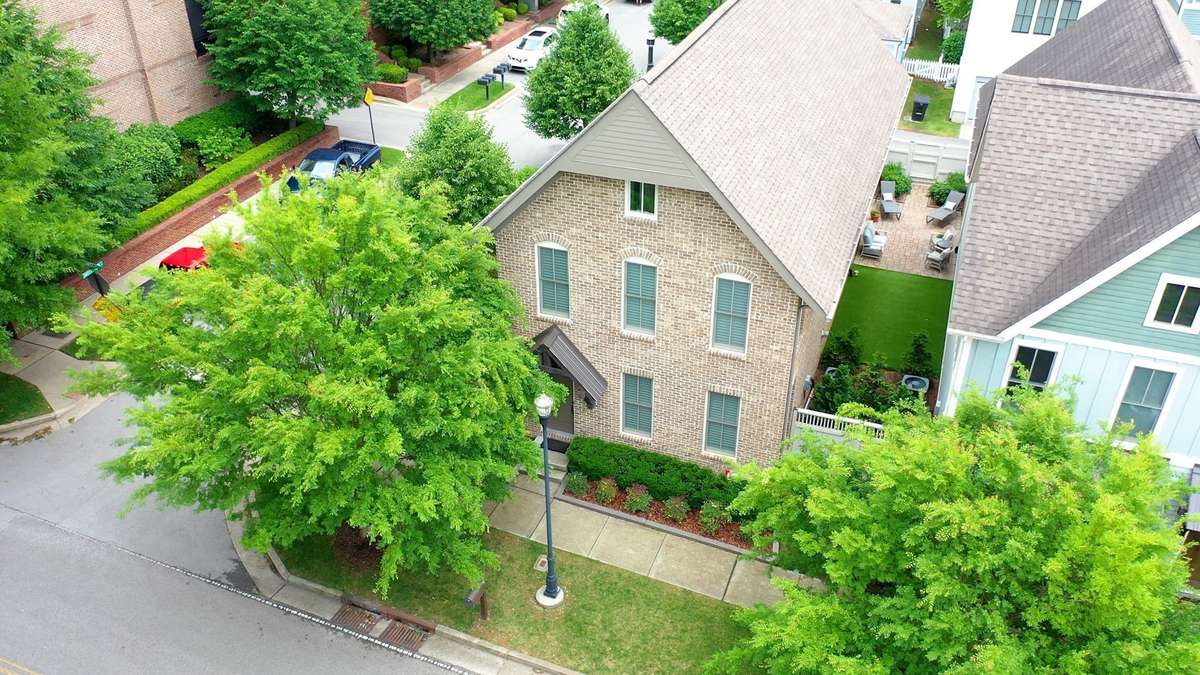 This detached, brick home is located on a corner lot between The Factory and Downtown Franklin