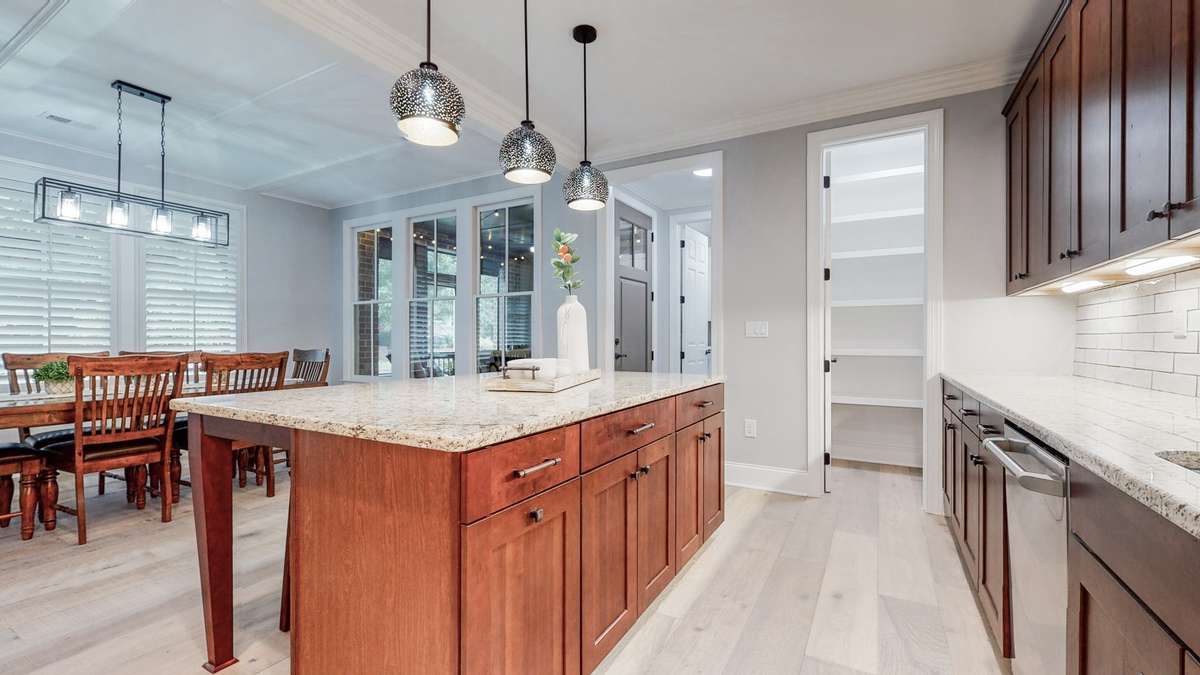 Another view of the kitchen and the pantry (right) & mudroom (left doorway)