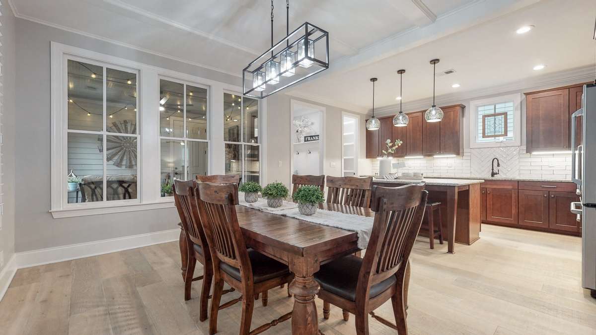 Welcome to 20 Daniels Drive in Franklin TN! Open Kitchen and Dining with a view of the screened porch! New hardwood flooring, lighting and paint throughout