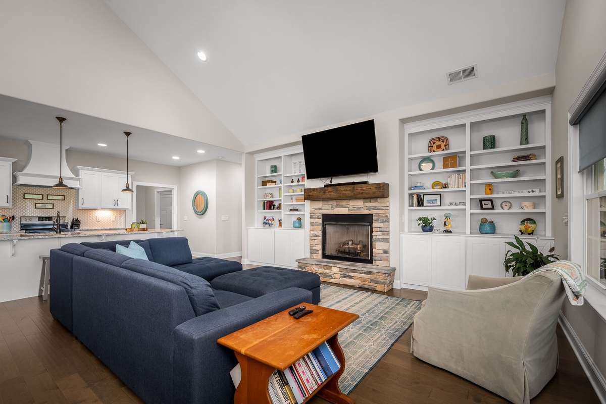 The high ceilings feature recessed lights and add to the openess of this space.