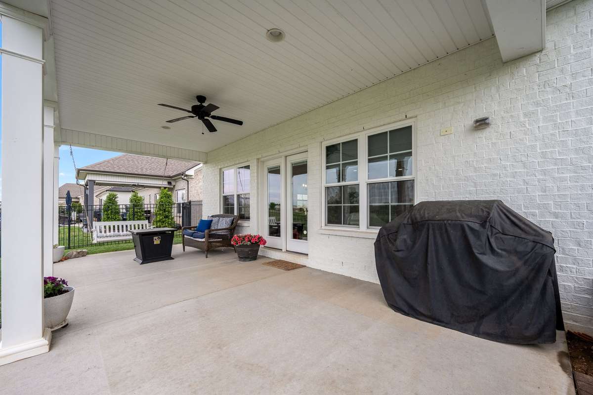 Outdoor space is complete with ceiling fan and overhead recessed lights. Enjoy a peaceful early morning or late afternoon in the shade.
