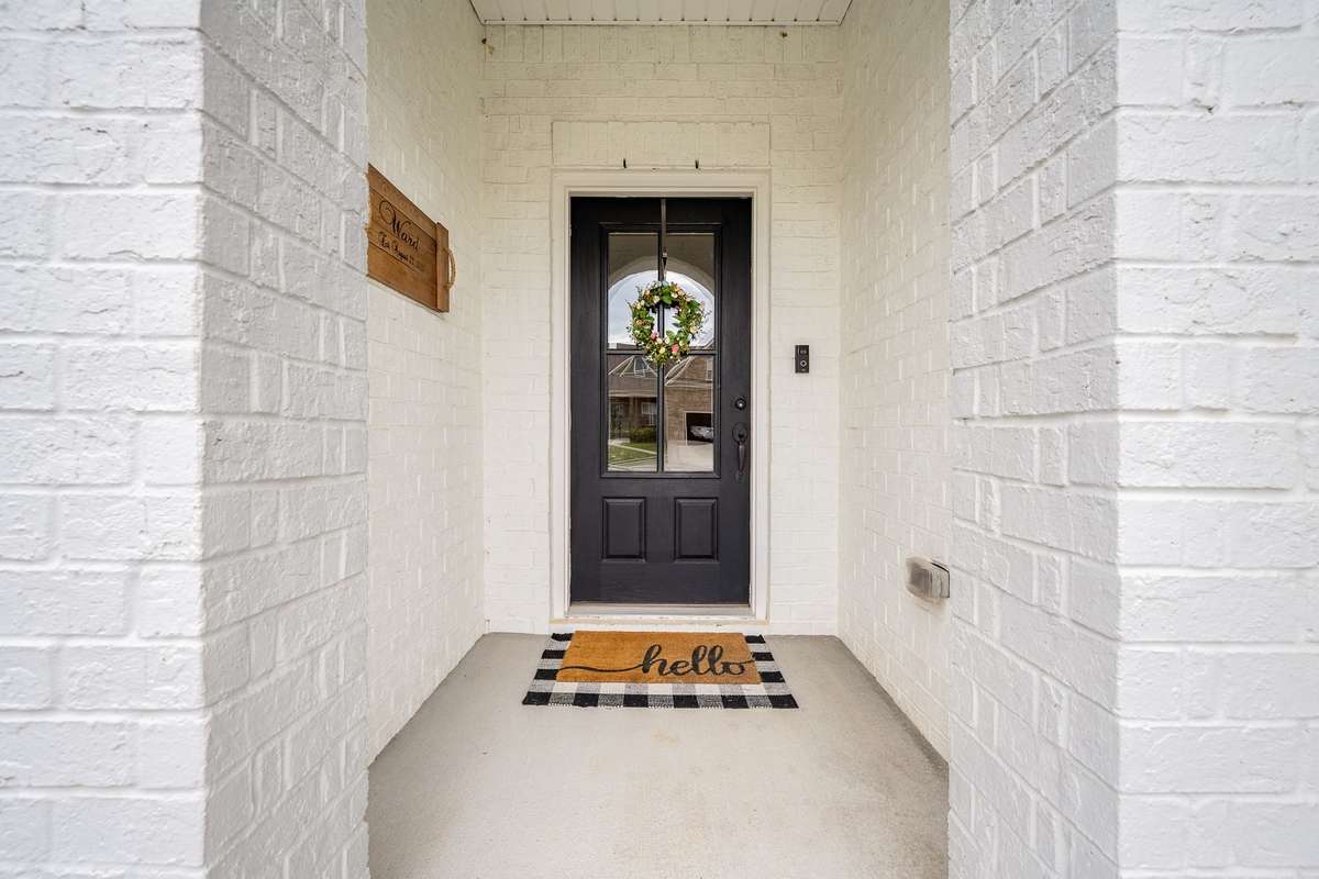 Covered entryway keeps your visitors (and packages!) protected from the elements. Provides a layer of privacy from the street.