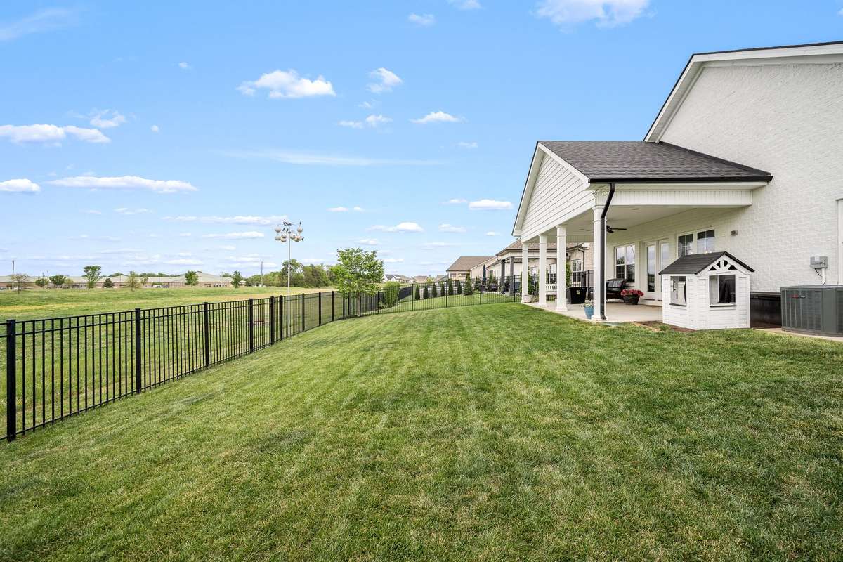 Backyard looks over HOA owned green space and then middle school recreation fields.  There are no houses behind you - hard to find in new construction.