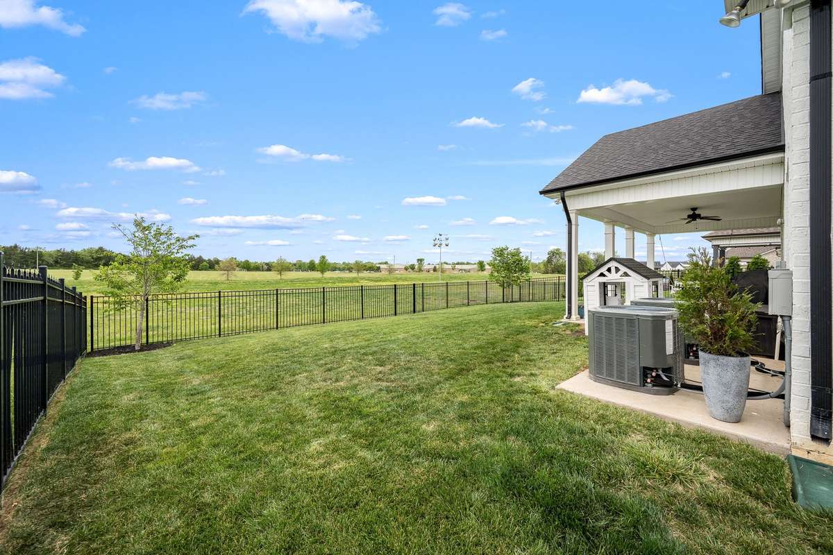 Backyard is completely fenced.  Current owners added  trees in the backyard which you will enjoy in the years to come.