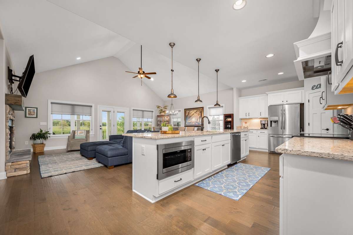 One of the inviting features of this home is the very open living space.  Kitchen, gathering space and dining area all connect making it a great family space and entertaining space.
