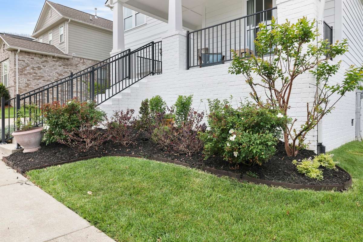 You'll appreciate the lovely landscaping---and a large, level backyard!