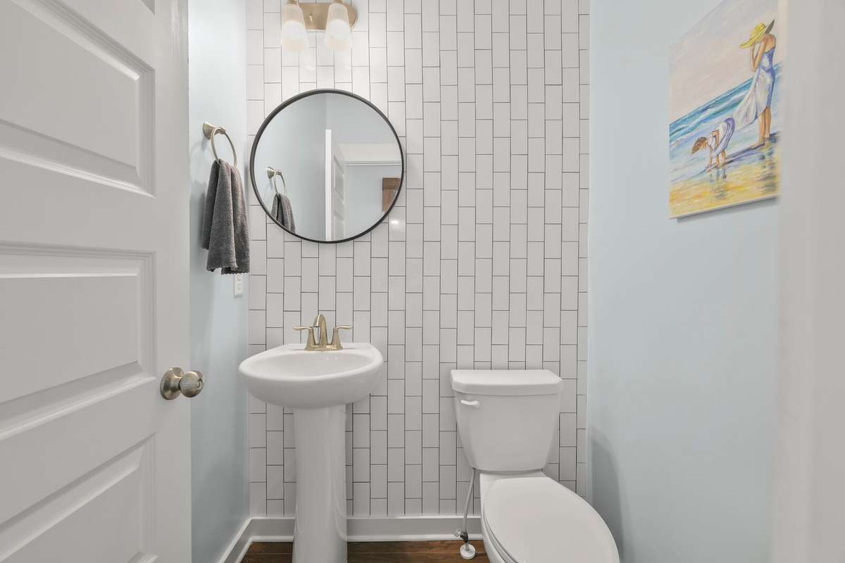 Tile accent wall in the downstairs half bath