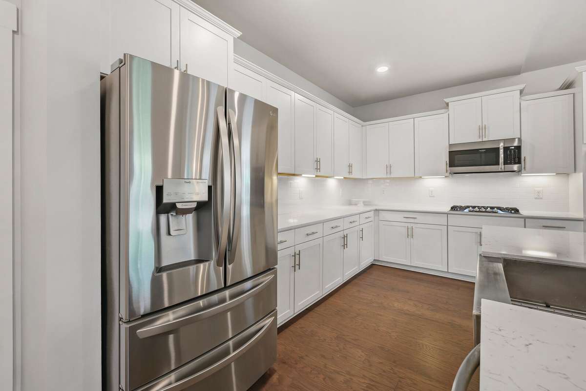 Under mount lighting, hardwoods, SS appliances and tons of storage space