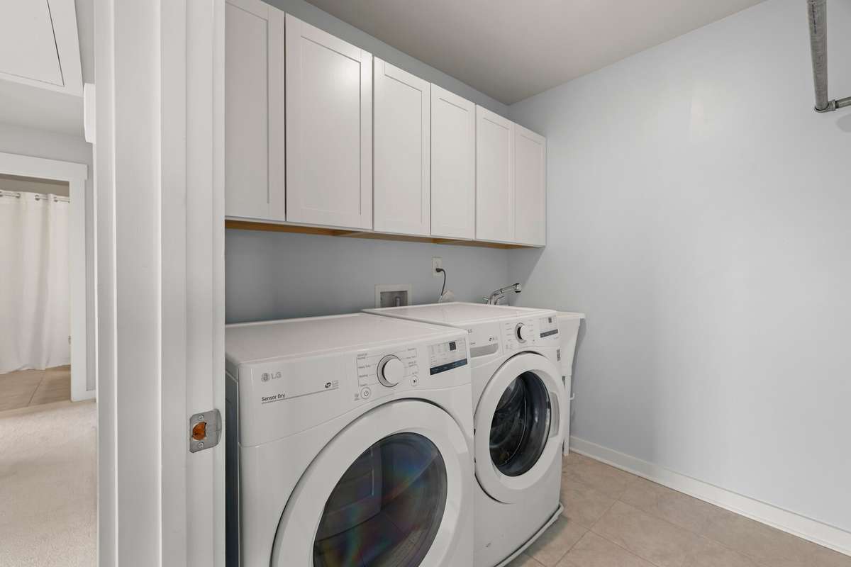 Laundry room has added storage and sink