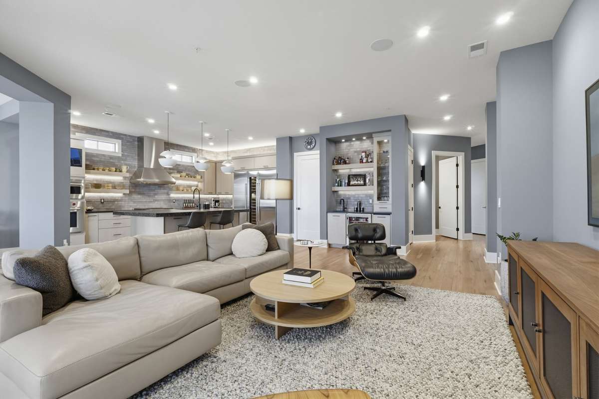 Elegant living room featuring wide-plank hardwood flooring and modern finishes.