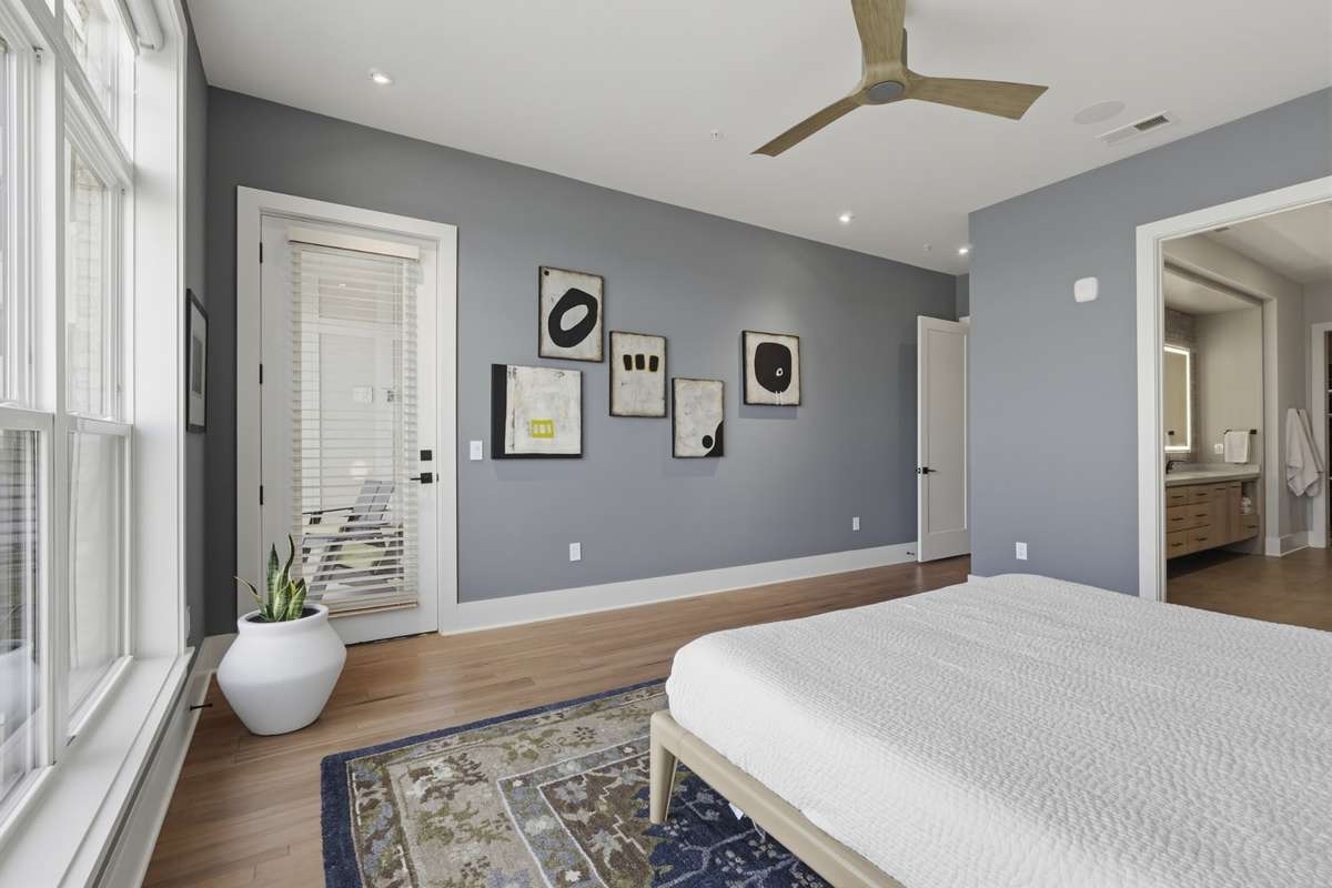 Private Primary retreat with direct access to spa-inspired bathroom and serene water views with a door leading out to the 2nd balcony.