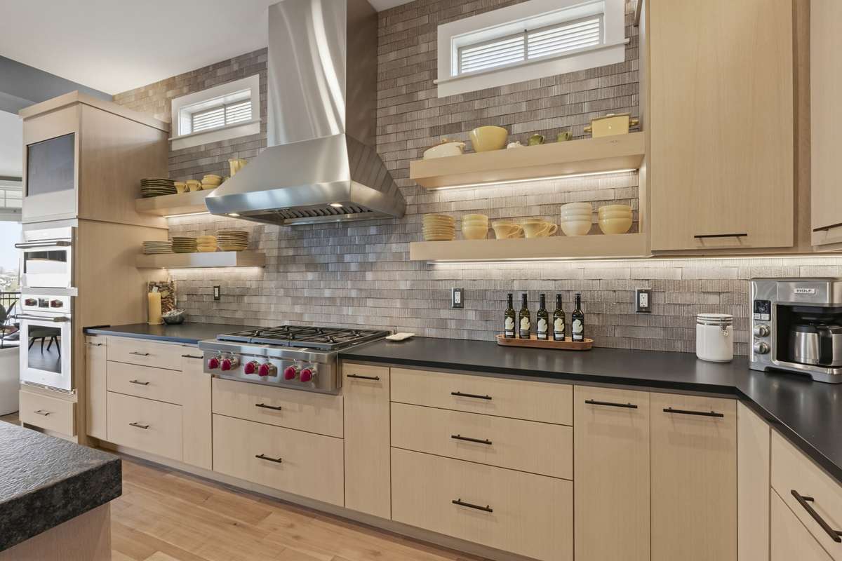 Thoughtfully designed kitchen with abudant cabinetry, workspace, and luxury detailing.