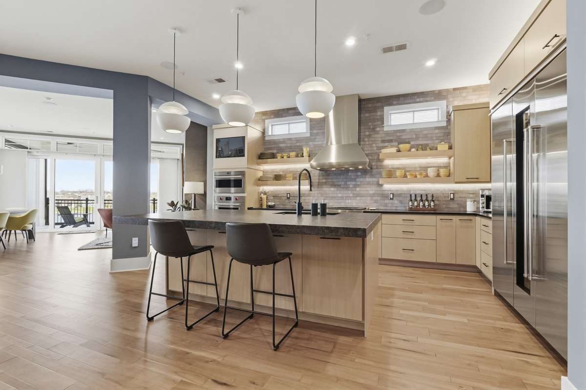 Chef's kitchen featuring oversized island, premium appliances, and open layout ideal for entertaining.
