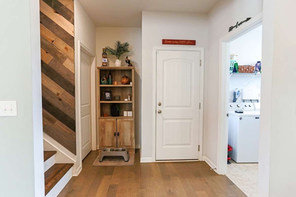 Big laundry room located away from the bedrooms just off the garage